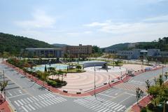 Square of Peace at Dankook University Jukjeon campus with modern buildings and green trees