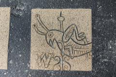 Close-up of mosaic depicting grasshopper weather vane on Faneuil Hall, Boston Latin School