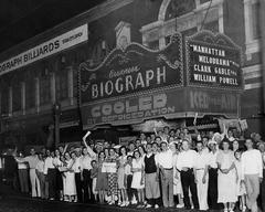 Crowd gathered at Chicago's Biograph Theater after John Dillinger's death with newspapers reading Dillinger Dead