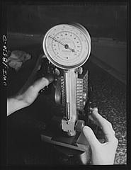 New York University industrial training class using precision instruments with female students testing hardness