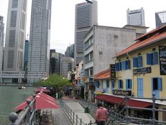 Boat Quay waterfront with boats and historic buildings in Singapore