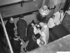 Mgr. J. P. Huibers officiating holy communion during the 75th anniversary celebration of the Amstelkring in Amsterdam on January 9, 1959