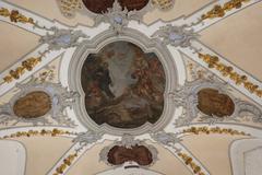 Frescos with stucco framing in a passage