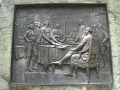 Relief sculpture at the base of Benjamin Franklin statue in Old City Hall Boston