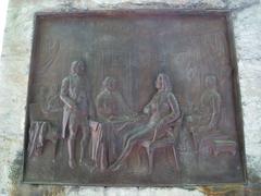 Relief depicting the signing of the Treaty of Paris at the base of the Benjamin Franklin statue