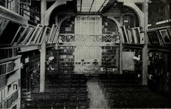 Historical hall interior of Boston Medical Library with wooden bookshelves and a reading area