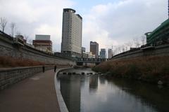 Cheonggyecheon stream near Dongmyo in Seoul with urban surroundings on a winter day