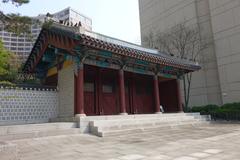 Hwangu-dan main gate with traditional Korean architecture under a blue sky