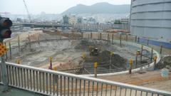 Construction site of Busan Lotte Tower in Busan, South Korea with cranes and building framework