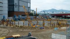Construction site of Busan Lotte Tower with cranes and structural framework