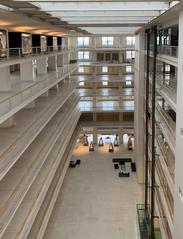 Interior of Veletržni palác in Prague with modern art displays and people in July 2019