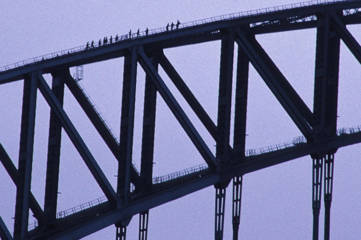 Sydney Harbor Bridge during BridgeClimb with climbers on the arches