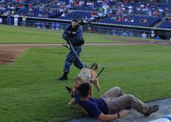 Military working dog performing patrol exercise during Navy Night at Harbor Park