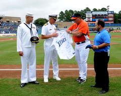 Capt. Karl O. Thomas receiving a signed Norfolk Tides team jersey at Harbor Park Stadium