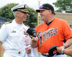 Capt. Karl O. Thomas of USS Abraham Lincoln joking with Norfolk Tides Manager Ron Johnson at Harbor Park Stadium