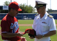 Mr. Gary Allenson and Capt. J.R. Haley exchanging ball caps at MWR event