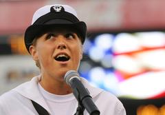 U.S. Navy Musician 3rd Class Sarah Janiak singing the national anthem during Norfolk Tides Navy Day celebration