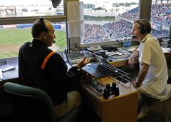 Pete Michaud conducting a radio interview with Rear Adm. Ted Branch at a Norfolk Tides baseball game