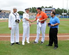 Captain Karl O. Thomas shaking hands with Norfolk Tides Manager Joe Gregory at Harbor Park Stadium during Lincoln Day