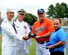 U.S. Navy Aviation Support Equipment Technician 1st Class Vincent Carmona, Capt. Karl O. Thomas commanding officer of USS Abraham Lincoln, Norfolk Tides managers pose before Lincoln Day at Harbor Park Stadium