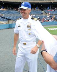 U.S. Navy Capt. Karl O. Thomas throwing the ceremonial first pitch at Lincoln Day celebration at Harbor Park Stadium