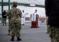 Lt. Cmdr. Genevieve Clark delivering Easter sunrise service on USNS Mercy flight deck during COVID-19 response