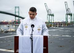 USNS Mercy hospital ship Easter sunrise service with ship chaplain delivering remarks on flight deck