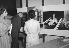 Exhibition about Brasilia with a city model and visitors viewing displays
