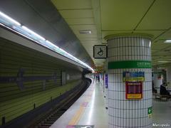 Chungjeongno Station entrance with busy pedestrian crossings and urban buildings in Seoul