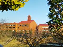 Bunkyo University Shonan Campus across a regulating pond in Chigasaki Kanagawa Japan