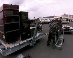 US Air Force members at McGuire Air Force Base unloading equipment from a pallet during Operation Allied Force at Budapest International Airport, Hungary