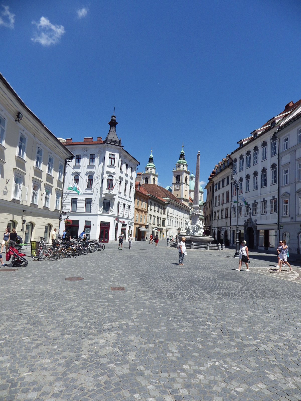 Scenic view of Ljubljana city with river, historic buildings, and bridges