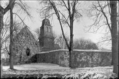 Southern view of Nydala Monastery ruin with visible remains of monastery church and Bondkyrkan towards west