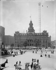 Historic view of downtown Detroit with Campus Martius Park, Detroit City Hall, and Moonlight Tower in the 1900s