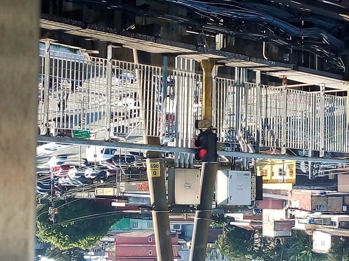Intersection of Avenida Carlos Caldeira Filho with Estrada de Itapecerica featuring Capão Redondo Station rail track