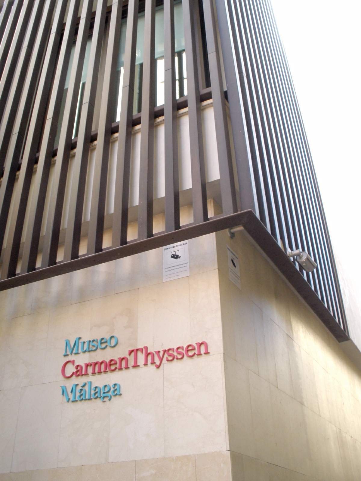Exterior view of Museo Carmen Thyssen Málaga with modern architectural design and clear blue sky