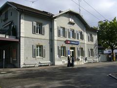 Train station building with the name Tiefenbrunnen visible