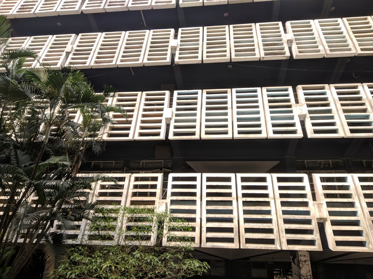 Modern architecture building with glass facade and geometric design