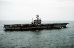 Starboard view of aircraft carrier USS John F. Kennedy (CV-67) approaching Naval Station Norfolk after Persian Gulf deployment during Operation Desert Storm