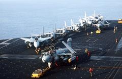 EA-6 Prowler aircraft being towed on the flight deck of aircraft carrier USS John F. Kennedy during NATO Exercise DISPLAY DETERMINATION '86