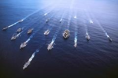 Aerial view of the USS John F. Kennedy (CV-67) aircraft carrier battle group underway in the Atlantic Ocean with 18 ships in formation