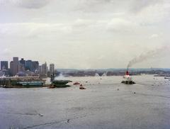 RMS Queen Elizabeth II entering Boston Harbor passing USS John F. Kennedy CV-67 aircraft carrier