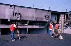 Crew from Naval Audiovisual Center filming motion picture footage on aircraft elevator aboard USS John F. Kennedy CV 67