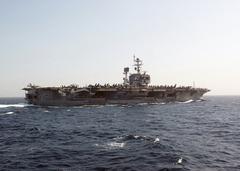 Starboard side view of US Navy Aircraft Carrier USS John F. Kennedy underway in the Arabian Sea