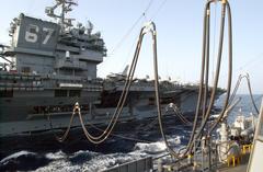 USS Seattle transferring fuel to USS John F Kennedy during underway replenishment at sea