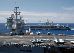 USS Enterprise and USS John F. Kennedy aircraft carriers transferring ammunition side by side in the Atlantic Ocean