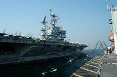 USNS Guadalupe transferring fuel to USS John F. Kennedy aircraft carrier in Arabian Gulf during replenishment at sea