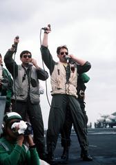 A landing signal officer and assistant aboard USS JOHN F. KENNEDY monitoring deck with light waveoff switches