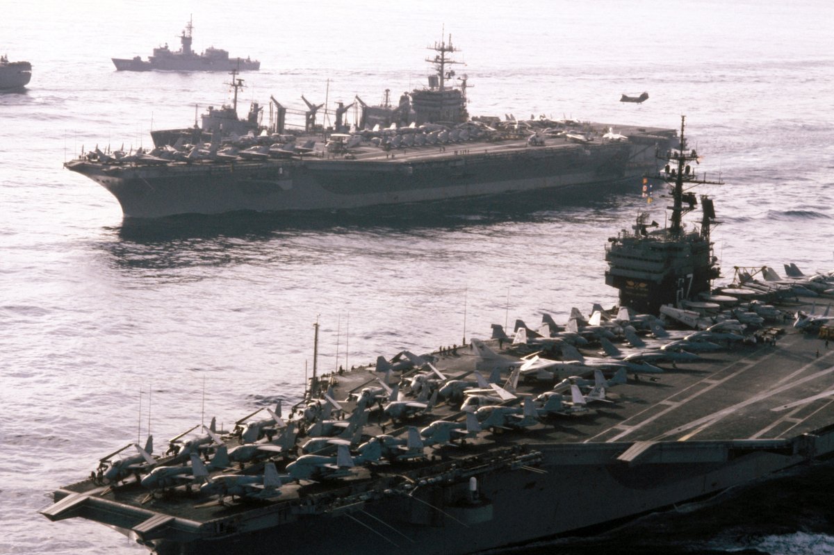 A port bow view of ships in Carrier Battle Group Eight underway off the coast of Lebanon including aircraft carrier USS John F. Kennedy CV 67 nuclear-powered
