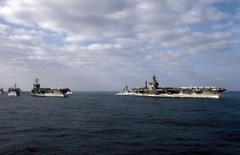 A starboard bow view of ships in Carrier Battle Group Eight underway off the coast of Lebanon including replenishment oiler USS Kalamazoo (AOR 6)
